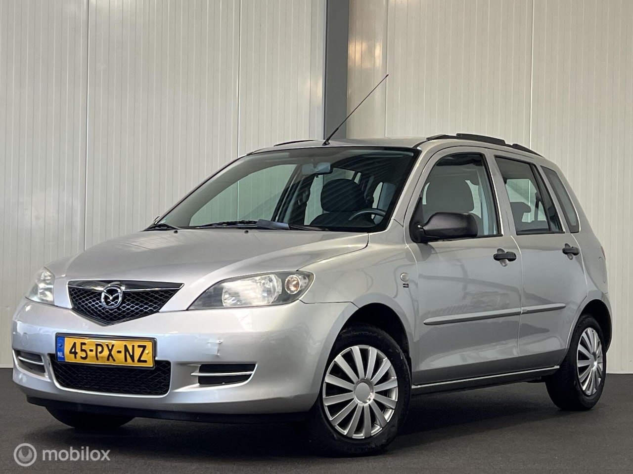 Mazda 2 - 1.4 Exclusive [ NAP trekhaak APK 18-04-2027 ] - AutoWereld.nl