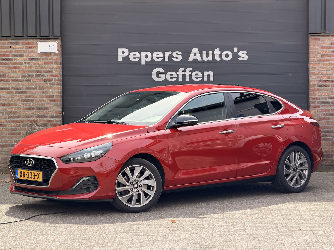 Hyundai i30 Fastback - 1.4 T-GDI Premium 141PK Navi Cruise Carplay PDC Camera - AutoWereld.nl