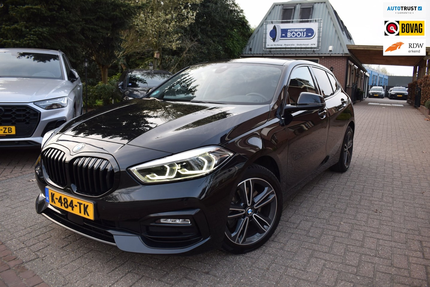 BMW 1-serie - 118i High Executive Edition AUTOM/NAVI/CRUISE/CARPLAY/AIRCO/XENON/NL-AUTO/BLUETOOTH//PDC V - AutoWereld.nl