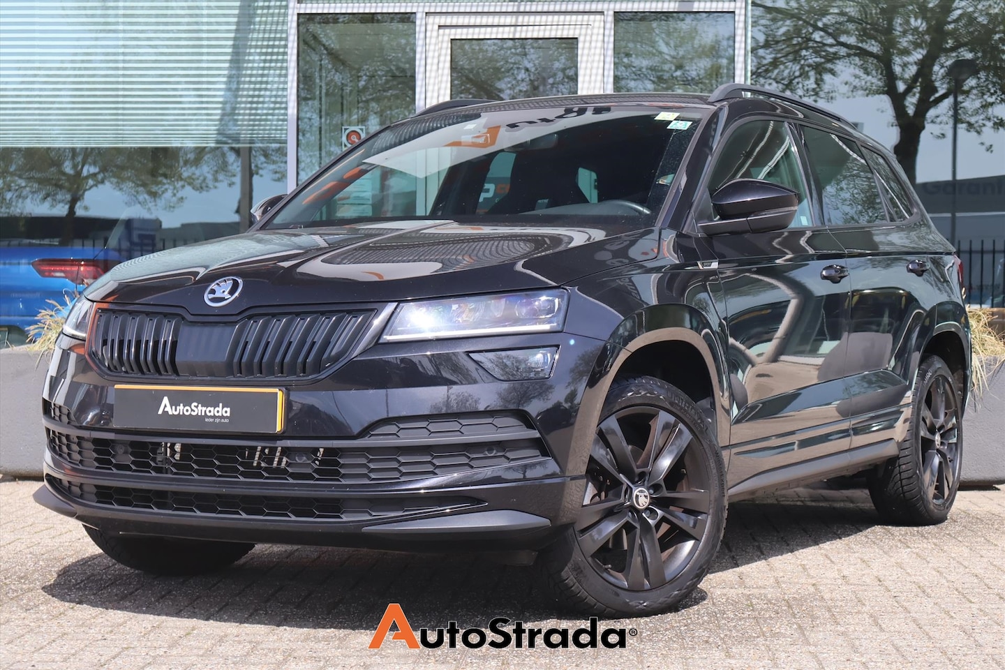 Skoda Karoq - 1.5 SportLine TSI ACT 150pk | ACC | Navi | Carplay | Dodehoek | Camera | Stoelverwarming | - AutoWereld.nl