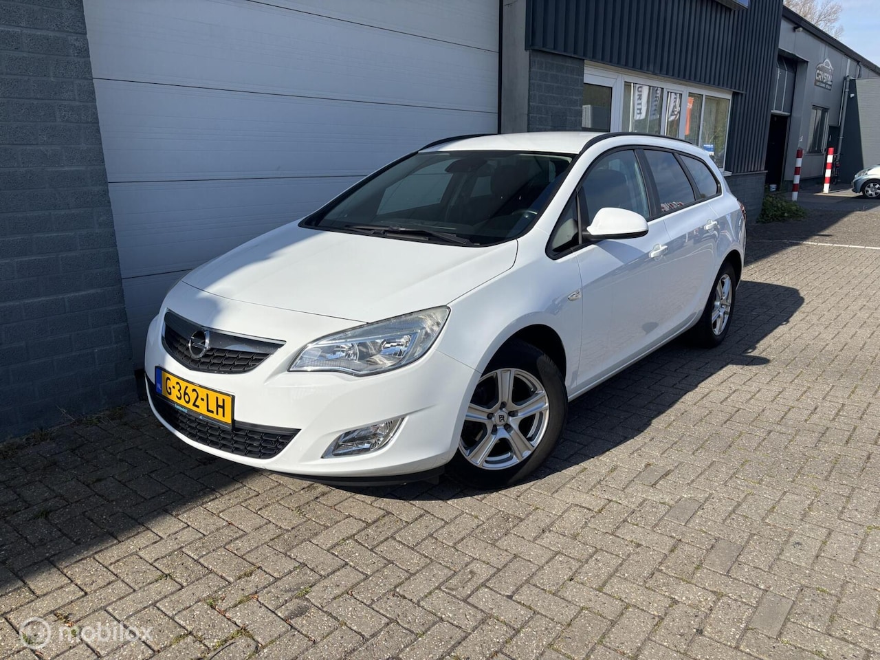 Opel Astra Sports Tourer - 1.4 Cosmo Cruise Navi Parkeersensoren! - AutoWereld.nl