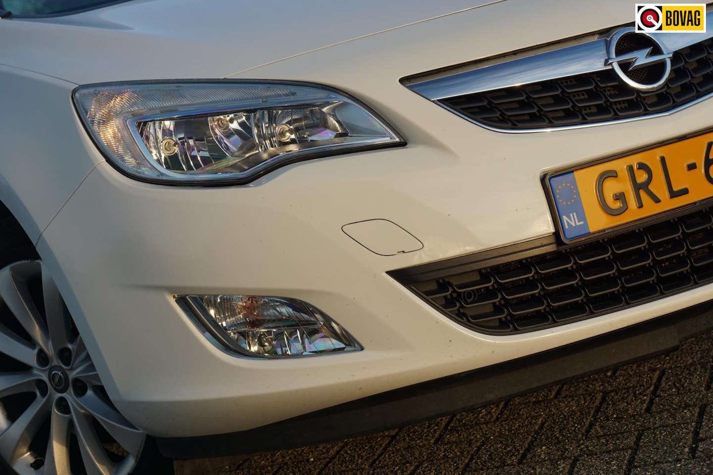 Opel Astra Sports Tourer - 1.4 Turbo 140pk Anniversary Edition - Summit White - Cruise/Clima/PDC - AutoWereld.nl