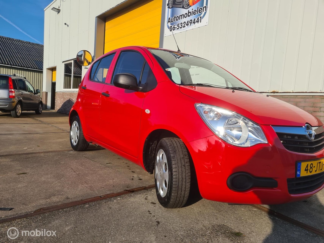 Opel Agila - 1.0 Essentia BJ 2009 65033 km org nap - AutoWereld.nl