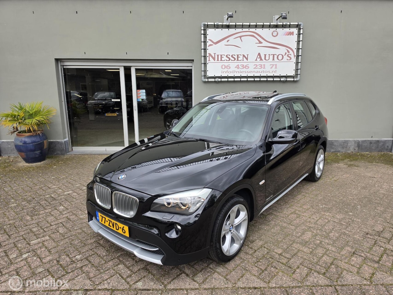 BMW X1 - E84 sDrive18i Executive Pano/Leer/Navi/Nwe Ketting - AutoWereld.nl