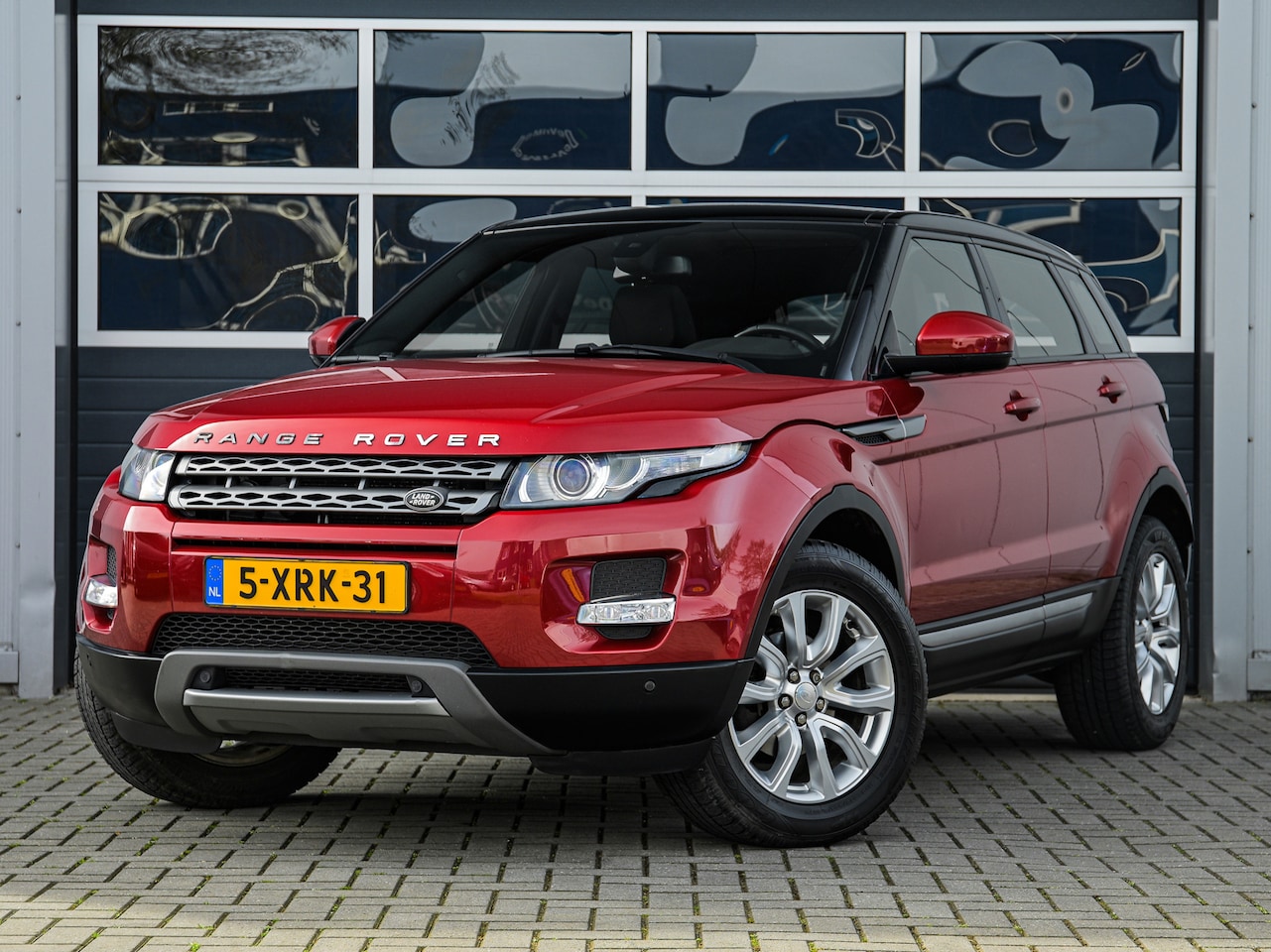 Land Rover Range Rover Evoque - 2.2 eD4 2WD Pure | Panoramadak | Leder | Camera | Navi | Stoelverwarming | Trekhaak - AutoWereld.nl