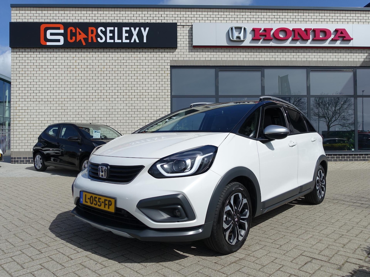 Honda Jazz - 1.5 i-MMD 109pk Hybrid CVT Crosstar ZWART DAK + ROBUST PAKKET - AutoWereld.nl