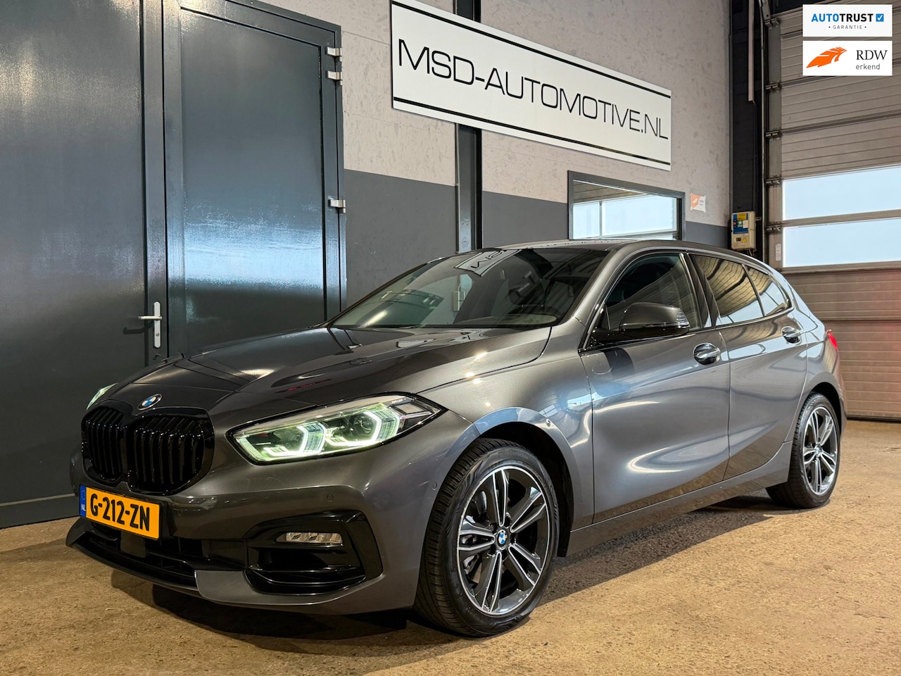 BMW 1-serie - 118i High Executive Edition Panoramadak Leer NAP - AutoWereld.nl