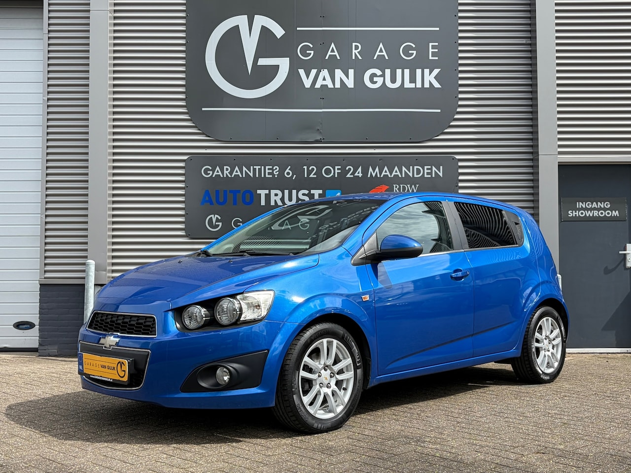 Chevrolet Aveo - 1.6 116PK Trekhaak,Airco,Cruise,Isofix,ElektrRamen+Spiegels,Stoelverwarming,Bluetooth,Park - AutoWereld.nl