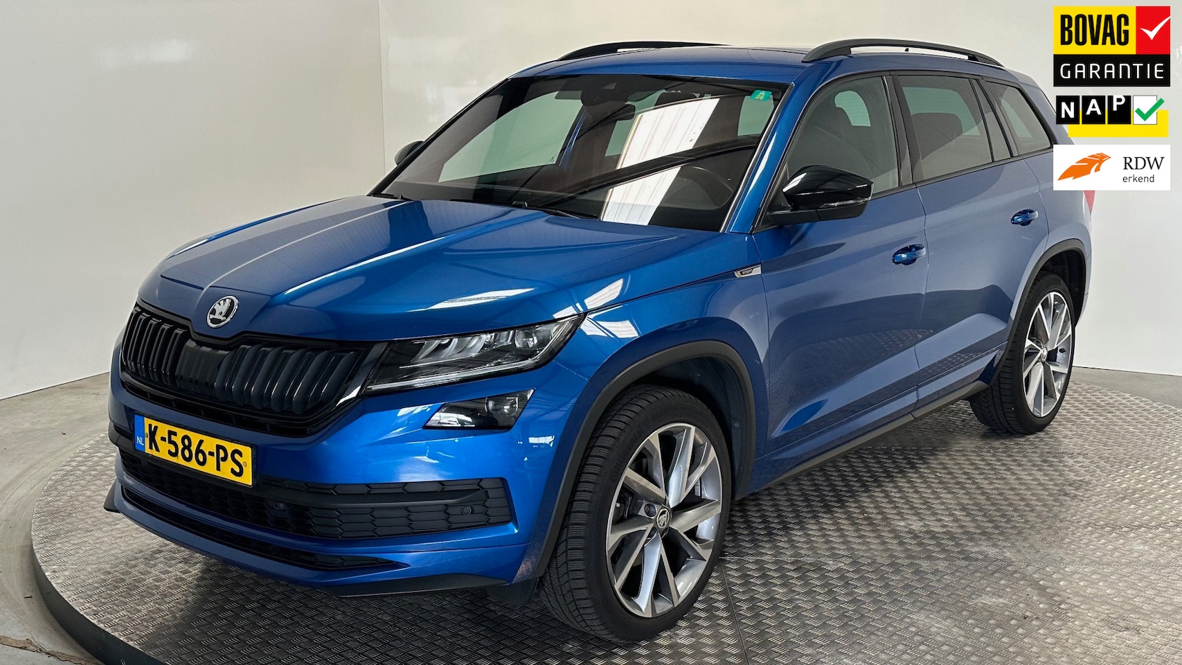 Skoda Kodiaq - 1.5 TSI Sportline Business benzine automaat trekhaak carplay android parkeersensoren stoel - AutoWereld.nl