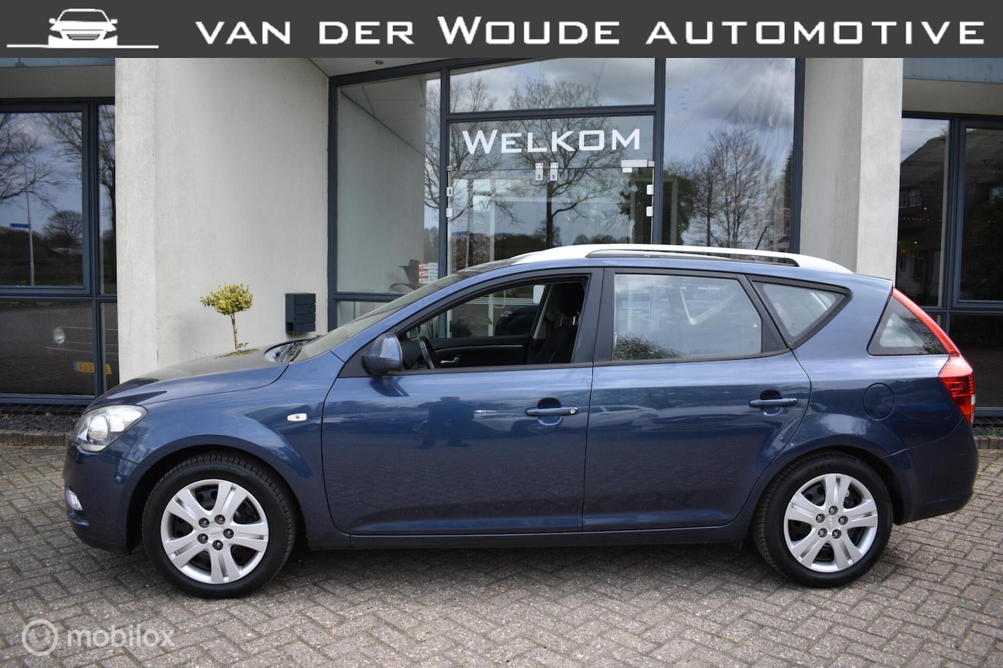 Kia Cee'd Sporty Wagon - 1.4 CVVT X-tra '09 Clima|Cruise! - AutoWereld.nl