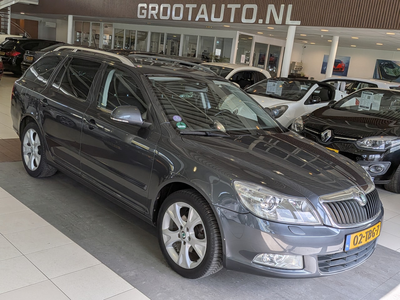 Skoda Octavia Combi - 1.2 TSI Elegance Business Line Airco, Cruise Control, Trekhaak, Stuurbekrachtiging - AutoWereld.nl
