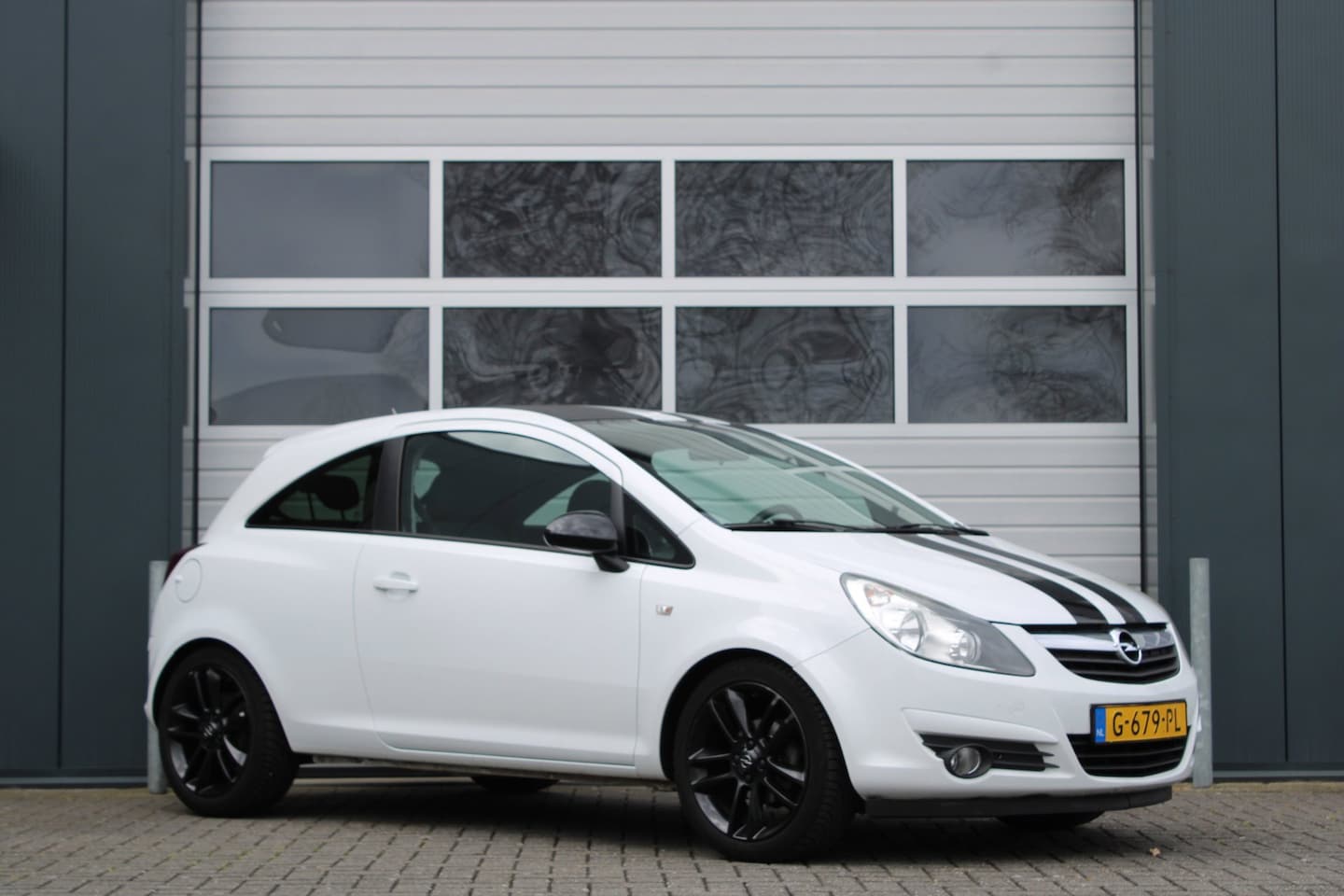 Opel Corsa - 1.4-16V Airco/Stoel&Stuurverwarming/PDC/Navi/Bluetooth/Sportstoelen/Elek.Ramen/C.V./Radio/ - AutoWereld.nl