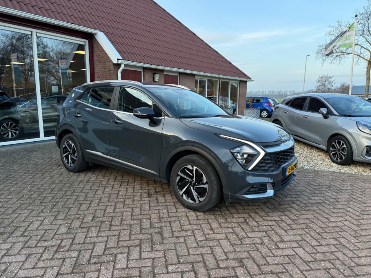 Kia Sportage - 1.6 T-GDI HYBID DYNAMIC LINE AUTOMAAT! - AutoWereld.nl