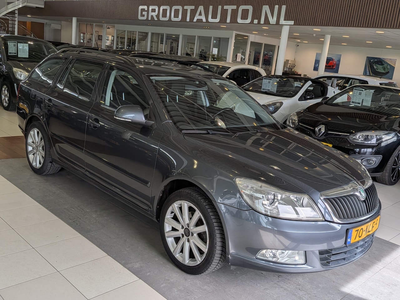 Skoda Octavia Combi - 1.4 TSI Ambition Business Line Airco, Cruise Control, Trekhaak, Stuurbekrachtiging - AutoWereld.nl