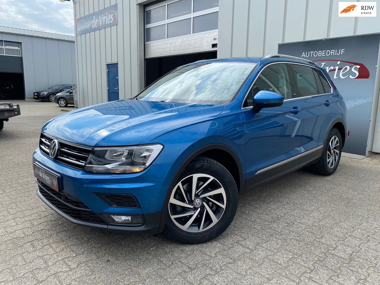 Volkswagen Tiguan - 1.4 TSI 150PK Comfortline / Clima / Cruise / Navi / Adapt. Cruise - AutoWereld.nl