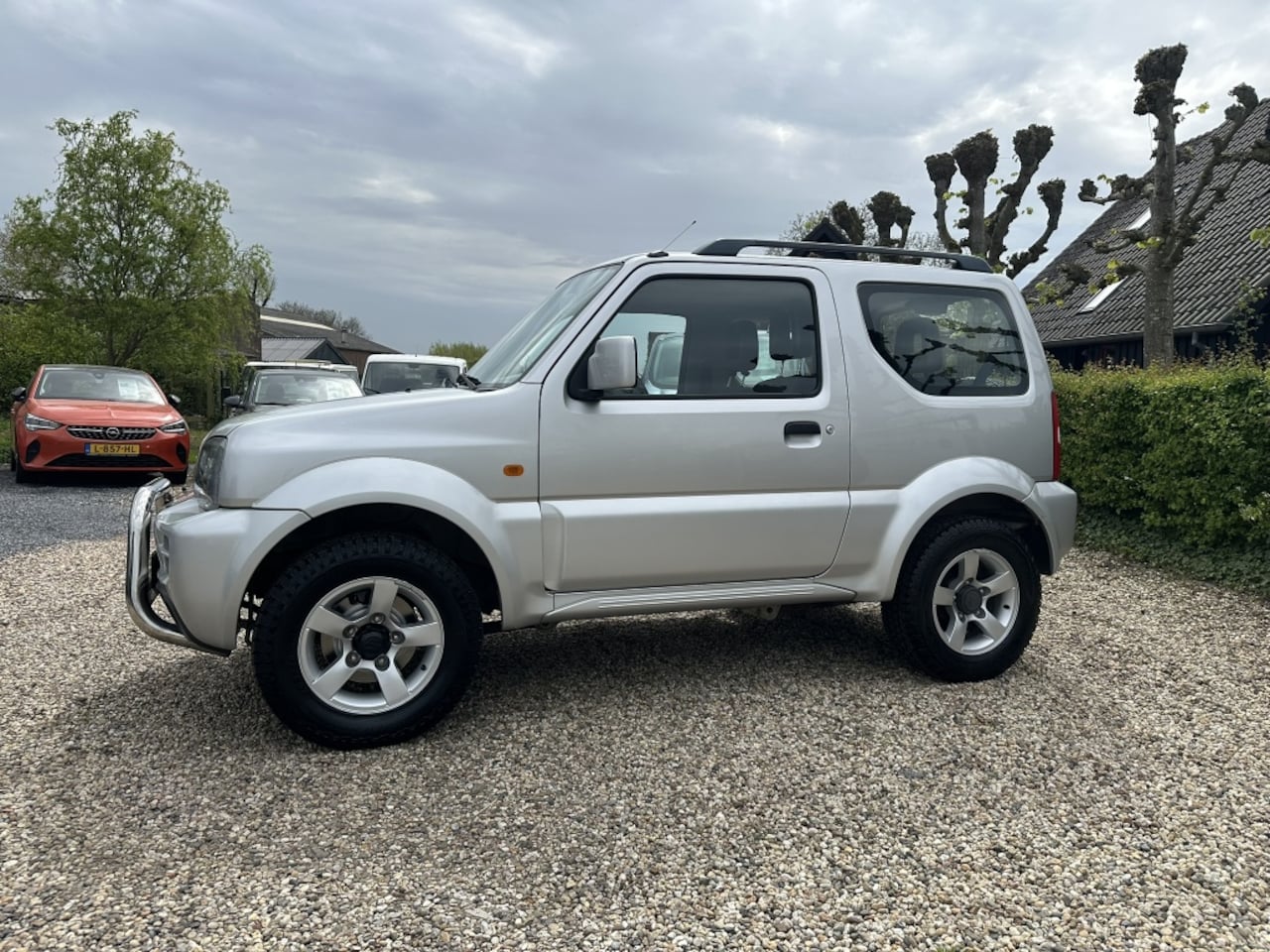 Suzuki Jimny - 1.3 X-citement Airco/Trekhaak/Pushbar - AutoWereld.nl