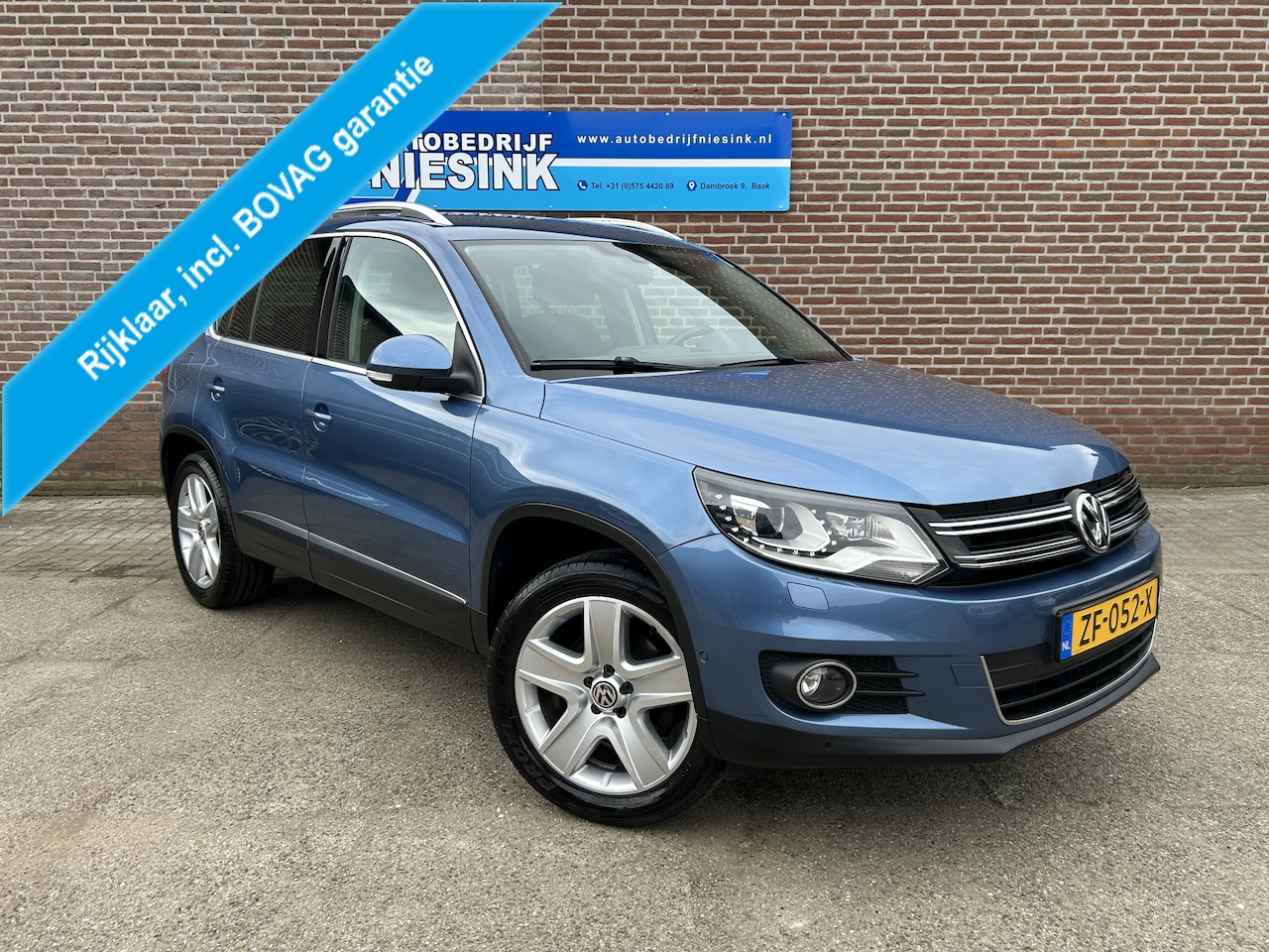 Volkswagen Tiguan - 1.4 TSI Sport&Style AIRCO/NAVI/TREKHAAK/STOELVERWARMING - AutoWereld.nl