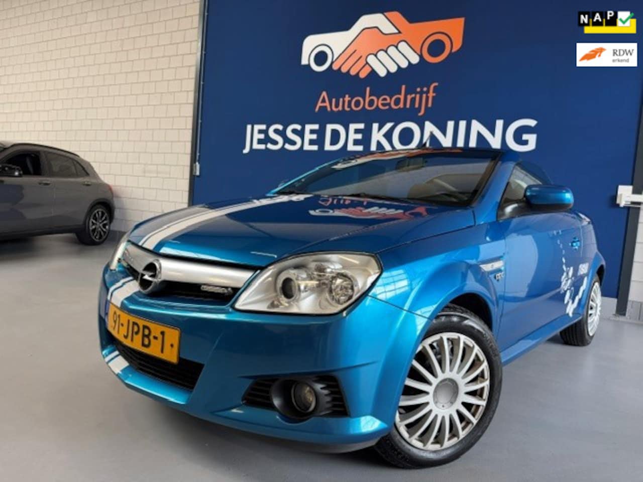 Opel Tigra TwinTop - 1.4-16V Rhythm / bj.2009 / kleur: blauw / NAP met 156174 km.en APK tot 05/2027 / Hardtop C - AutoWereld.nl