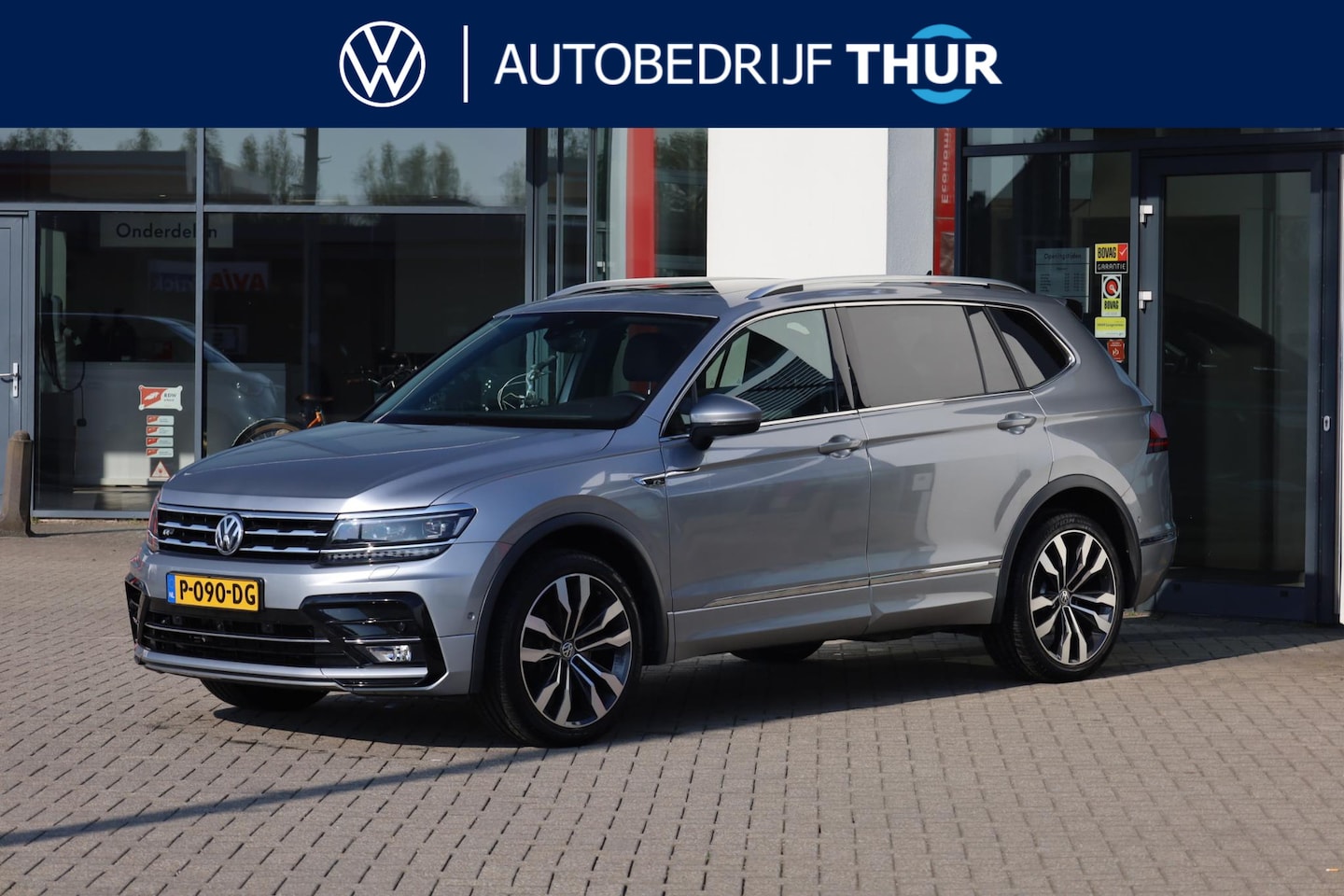 Volkswagen Tiguan - 2.0 TSI 4Motion R-Line 7p 7 zits r-line in en exterieur panoramadak 20" LMV Suzuka head up - AutoWereld.nl