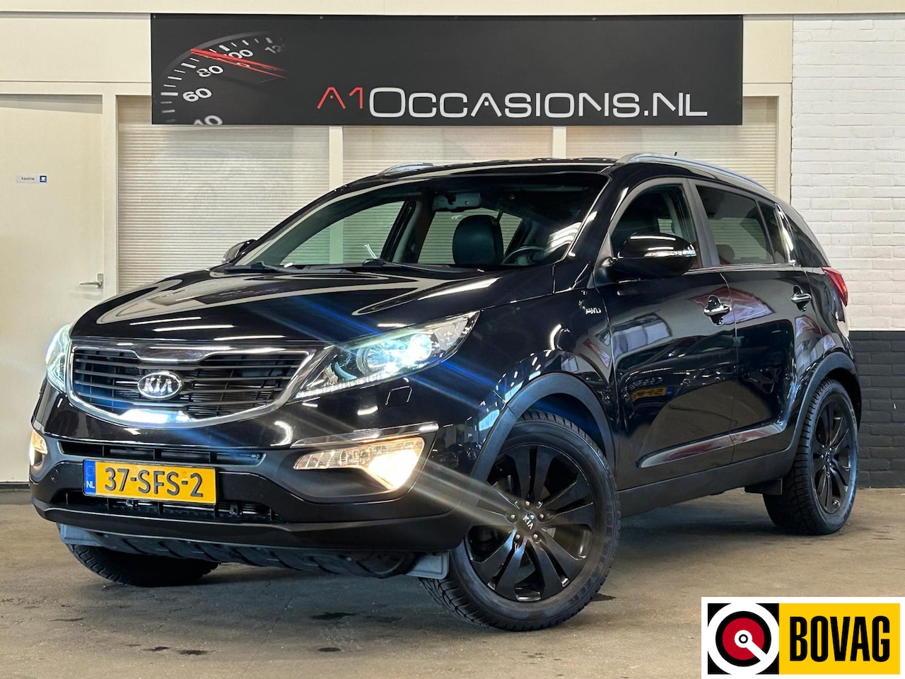 Kia Sportage - 2.0 X-clusive 4wd + LEDER + NAVI !! - AutoWereld.nl