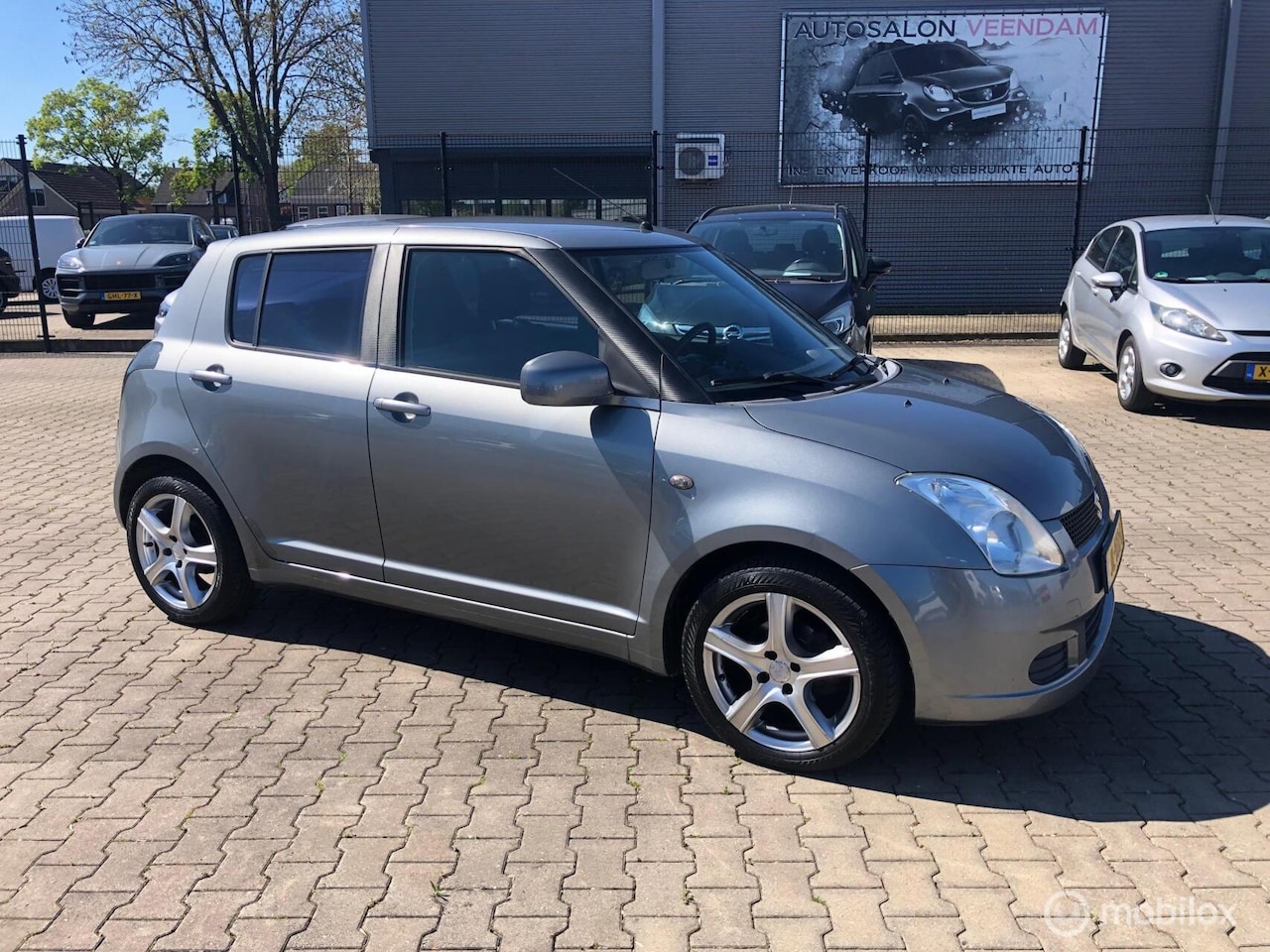 Suzuki Swift - 1.3 16V SPORT 4DRS AIRCO NAVI ELL PAK - AutoWereld.nl