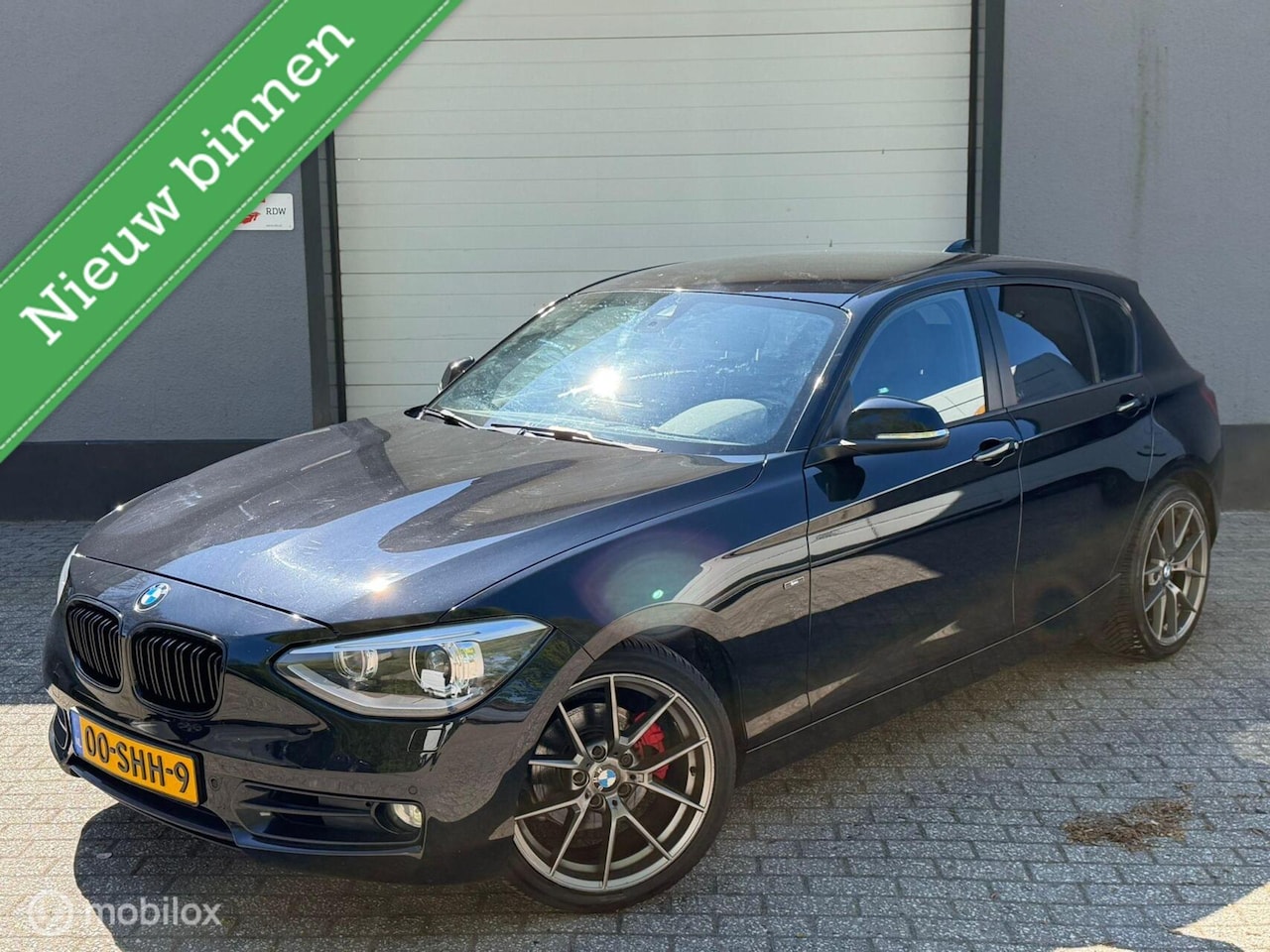 BMW 1-serie - 118i Sport Line / automaat / nap / navi / cruise - AutoWereld.nl