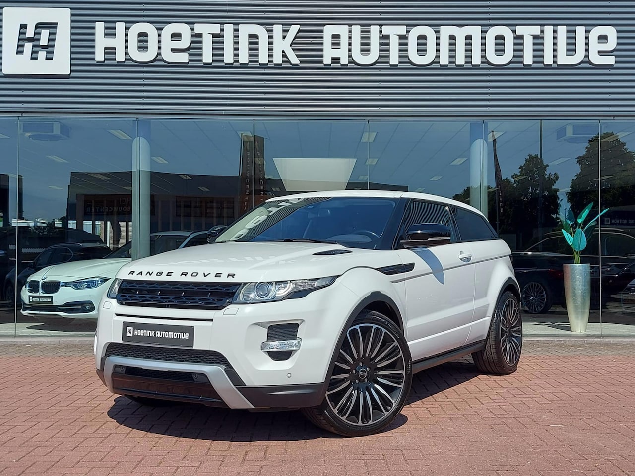 Land Rover Range Rover Evoque Coupé - 2.0 Si 4WD Dynamic | Leer | Cold Climate Pack - AutoWereld.nl
