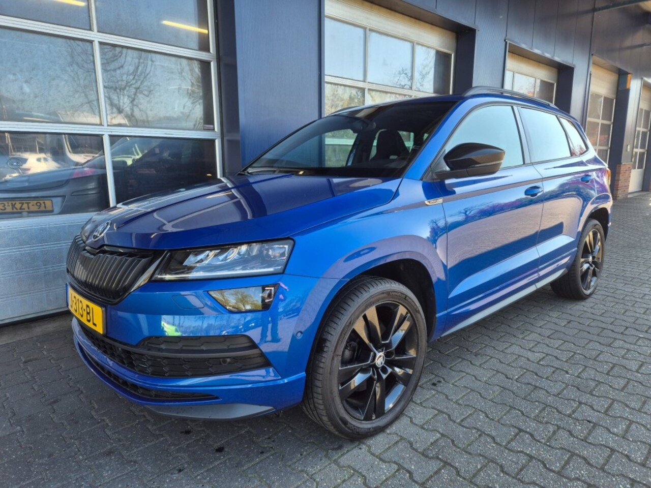 Skoda Karoq - 1.5 TSI ACT Sportline Business 1.5 TSI ACT Sportline Business, Automaat, PANO, Camera, Trekhaak, ACC, VCC, ALL IN Prijs! - AutoWereld.nl