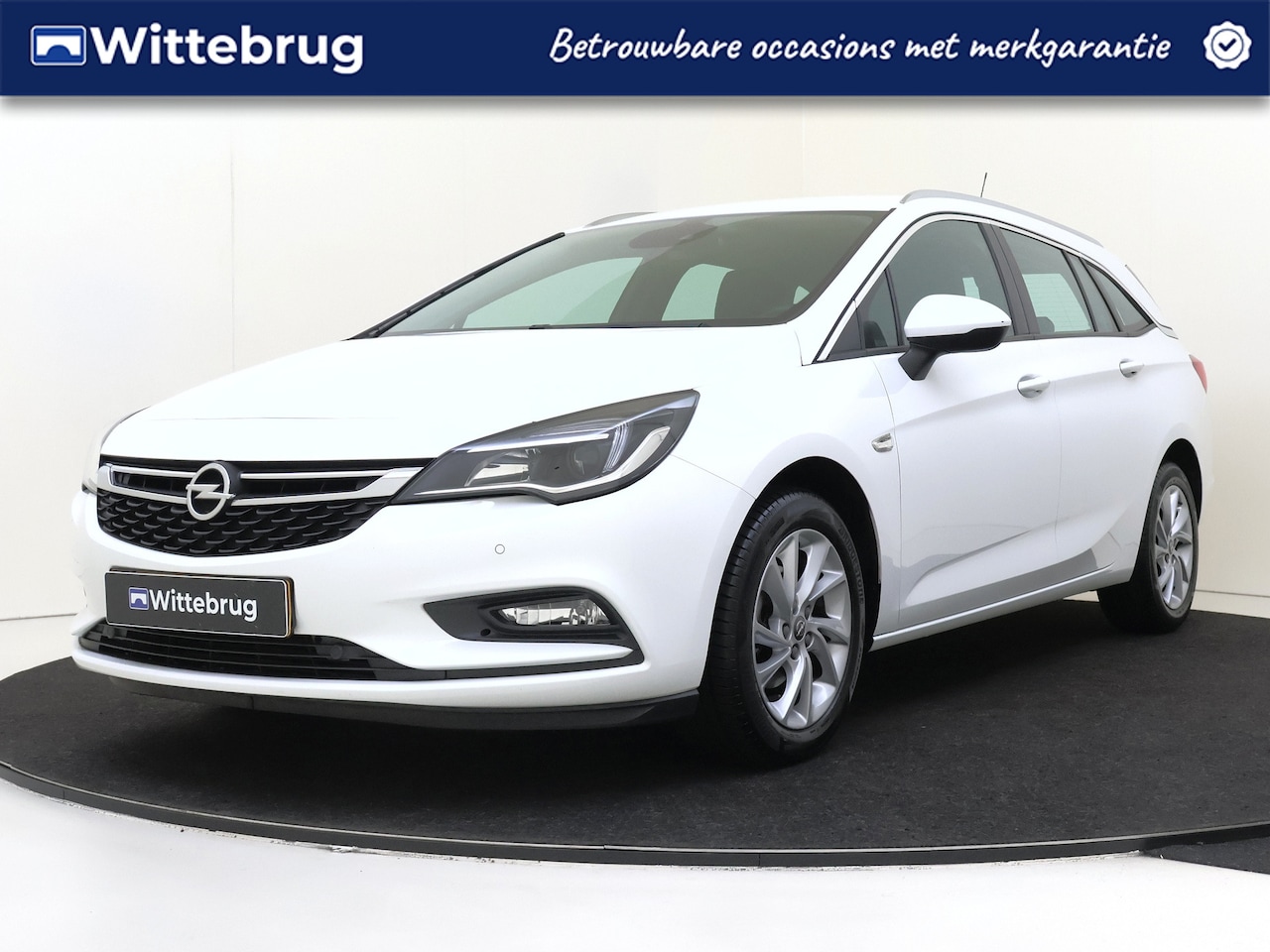 Opel Astra Sports Tourer - 1.4 150PK Innovation Navigatie | Half leder | Klimaatbeheersing | Parkeerhulp | Apple Carp - AutoWereld.nl