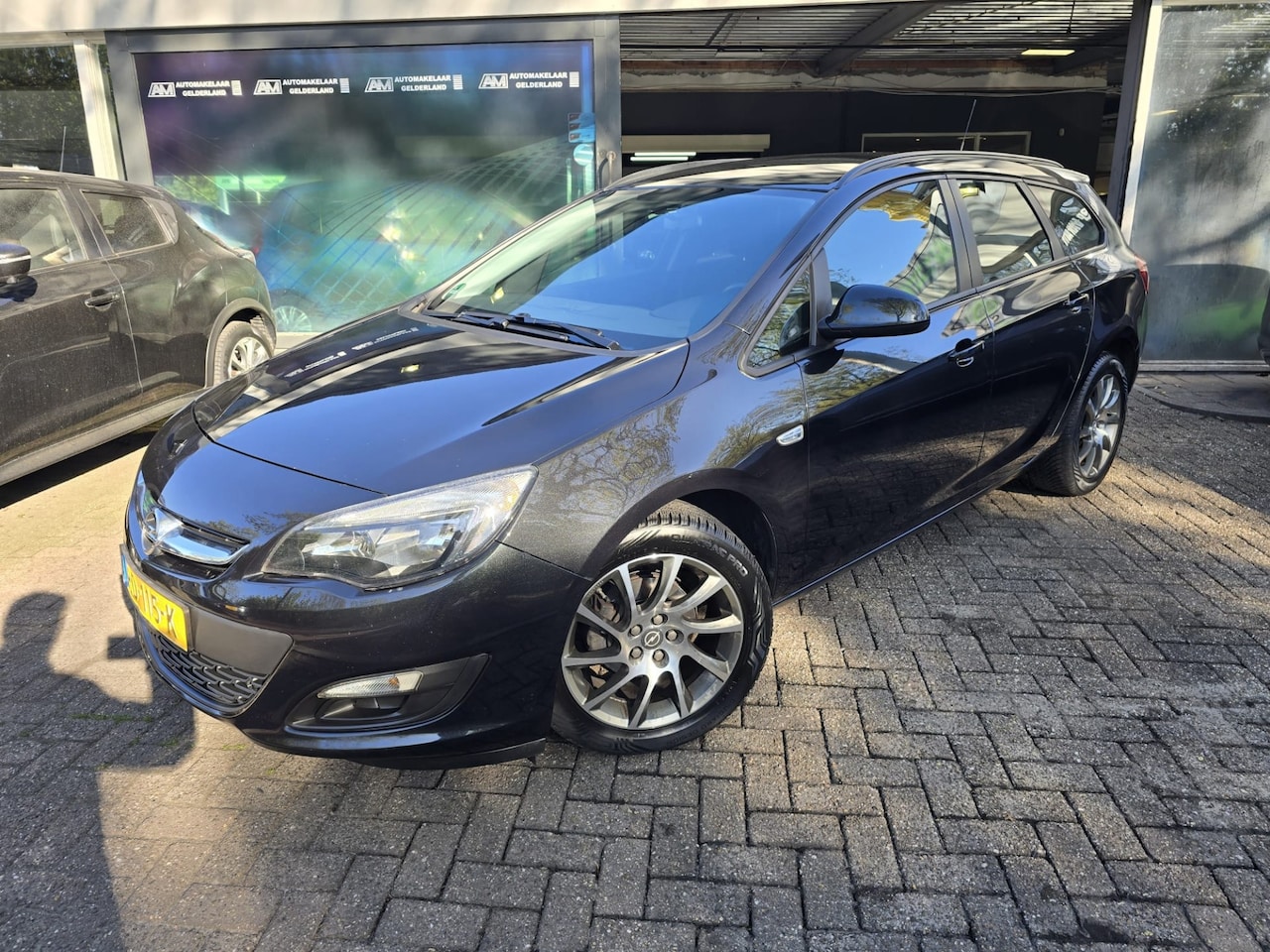 Opel Astra Sports Tourer - 1.4 Turbo Edition | AUTOMAAT | 12MND GARANTIE | AIRCO | CRUISE | LMV | - AutoWereld.nl