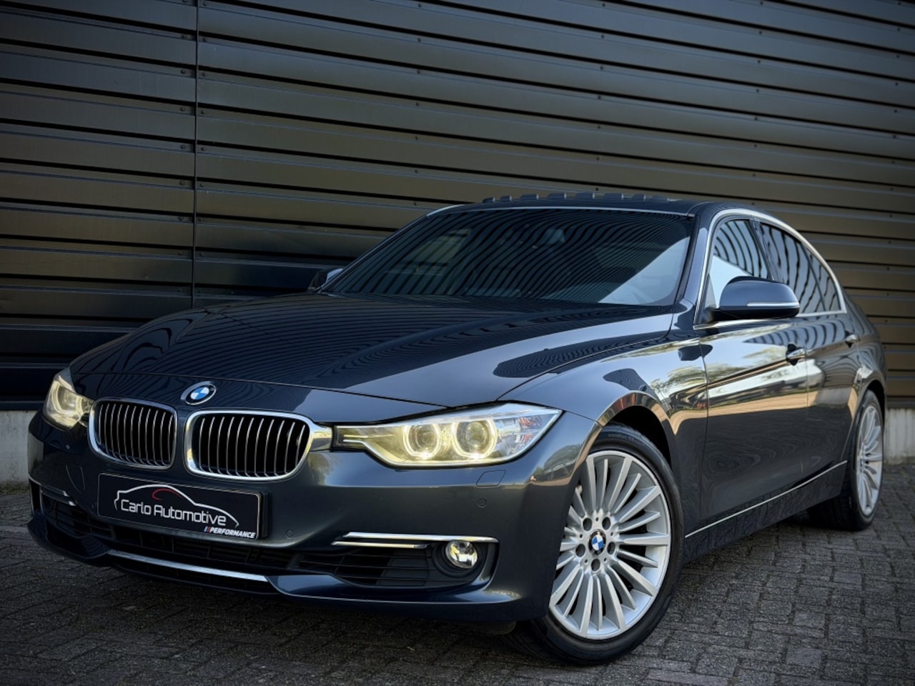 BMW 3-serie - 320i LuxuryL AUT|DAK|LEER|MEMORY|NAVIPRO|LED - AutoWereld.nl