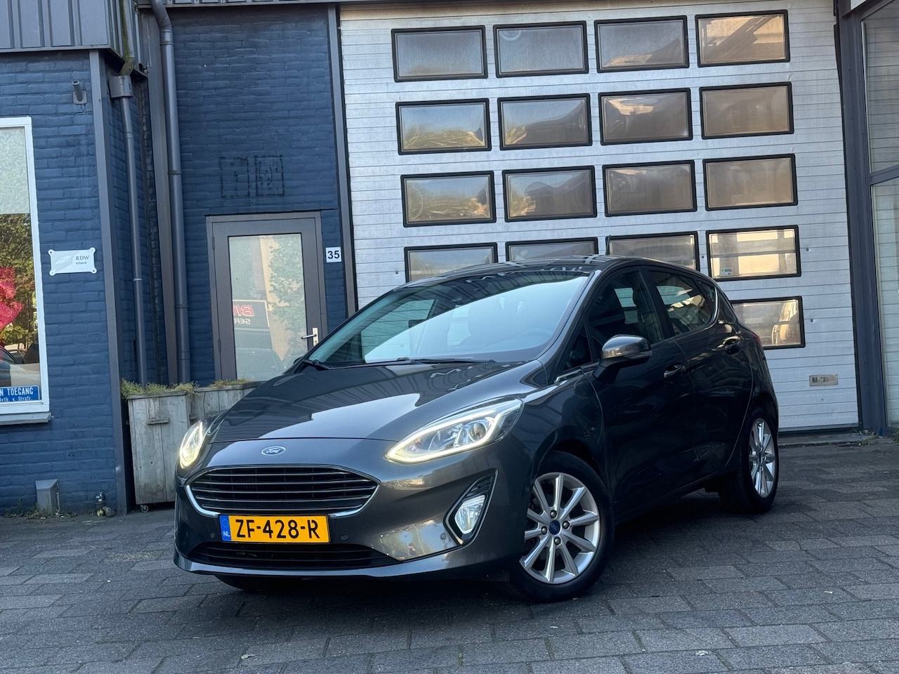 Ford Fiesta - 1.0 EcoBoost Titanium | Clima | Cruise | Camera | N.A.P - AutoWereld.nl