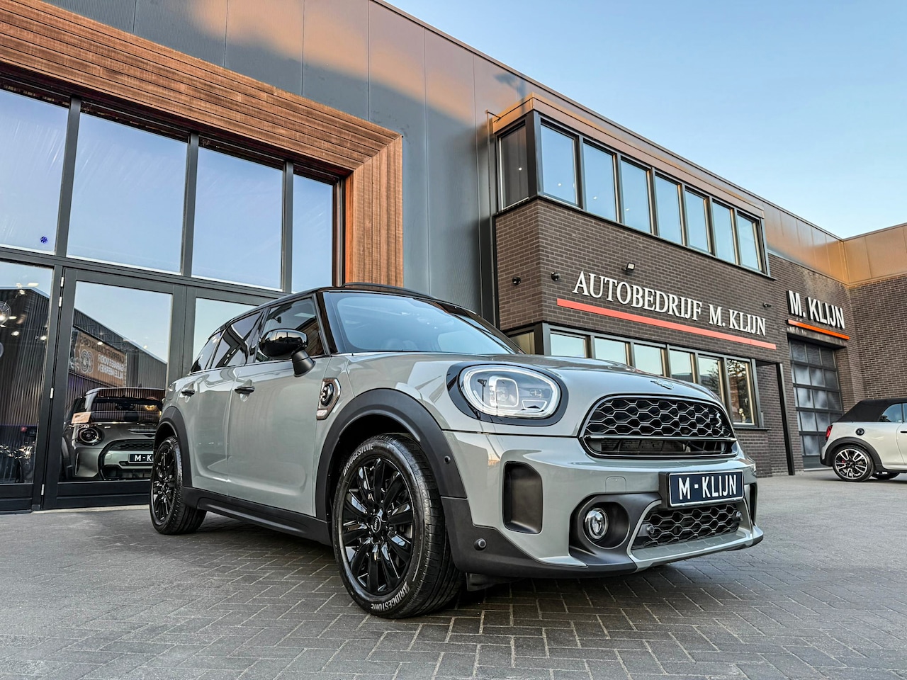 MINI Countryman - Mini 1.5 Cooper S E ALL4 Business Edition 220pk/Nardo/Leer/Hk/Camera/Head up/Pano - AutoWereld.nl