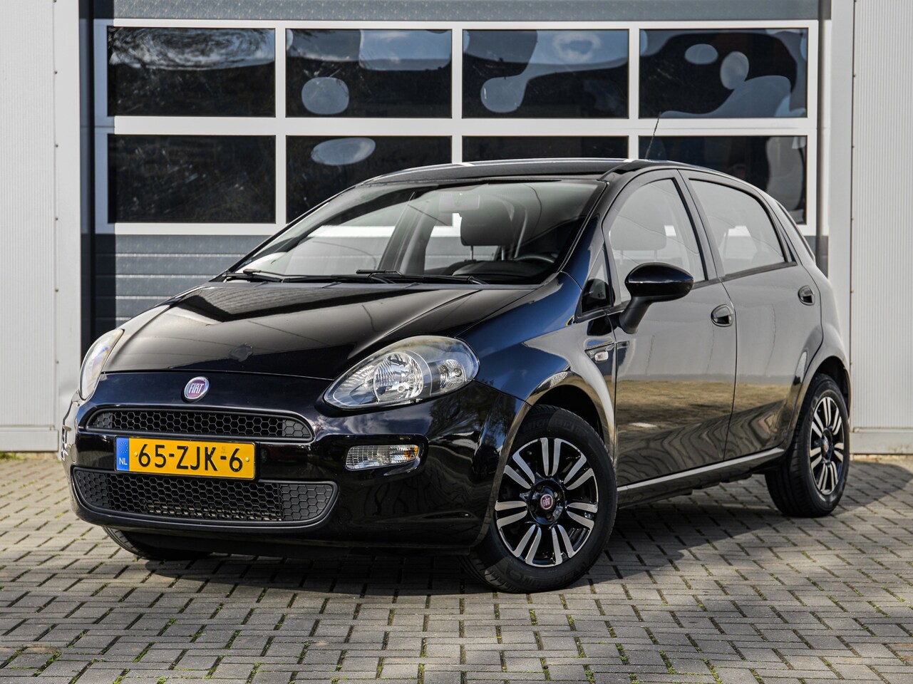 Fiat Punto Evo - 0.9 TwinAir Easy | Climate control | Cruise control | Bluetooth | Lichtmetalen velgen - AutoWereld.nl