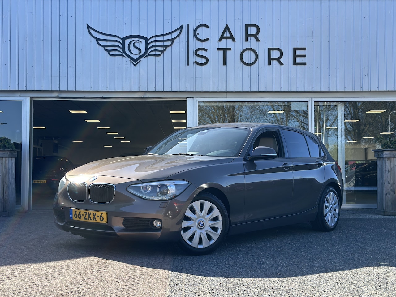 BMW 1-serie - 114i EDE Business+ |CRUISE|CLIMA|PDC|LEDER|BI XENON - AutoWereld.nl