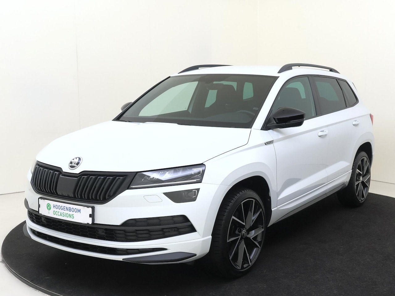 Skoda Karoq - 1.5 TSI ACT Sportline Business | CANTON audio | Achteruitrijcamera | Cruise control | CarP - AutoWereld.nl