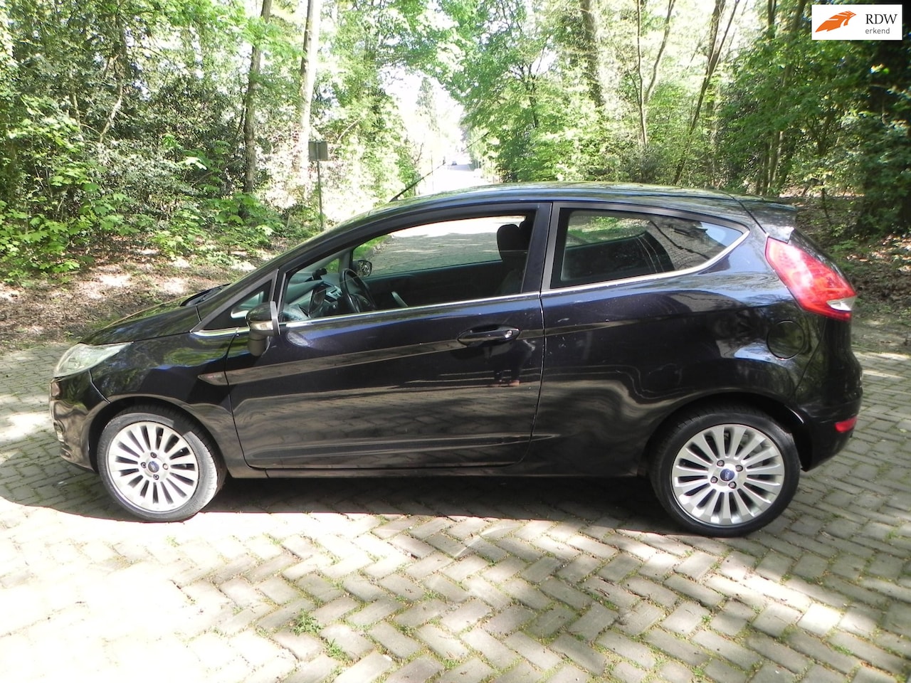 Ford Fiesta - 1.25 Ghia 1.25 Ghia - AutoWereld.nl