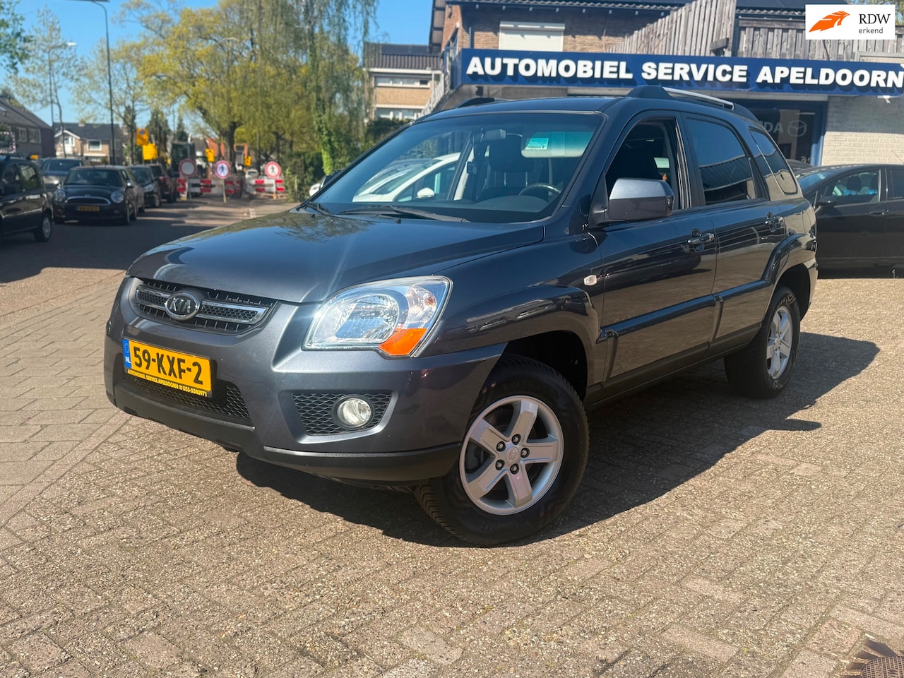 Kia Sportage - 2.0 CVVT X-tra *AIRCO*TREKHAAK*CRUISE.CTR*STUURBEKR.*PDC*LM.VELG*BOEKJES*NETTE AUTO - AutoWereld.nl