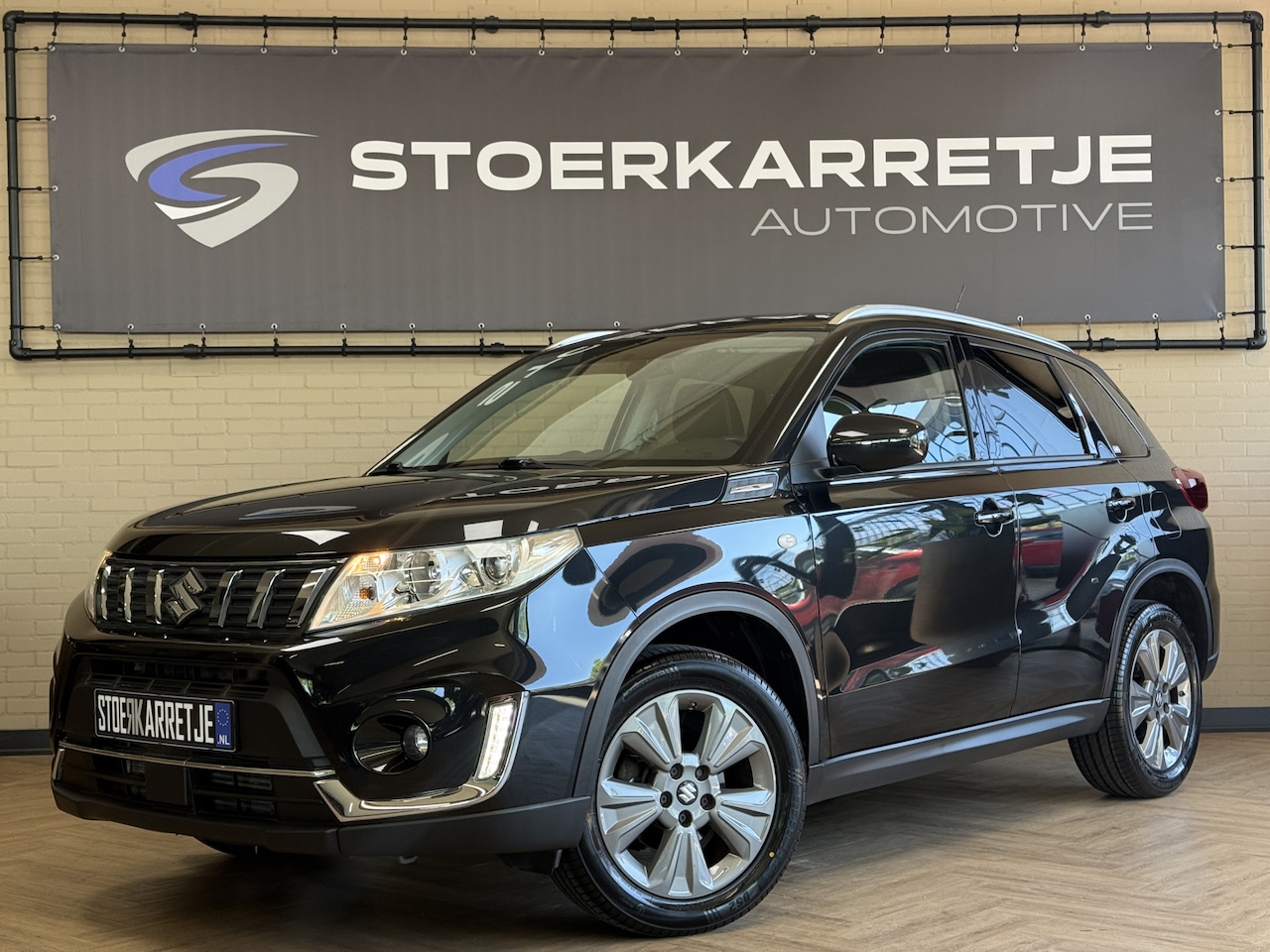 Suzuki Vitara - 1.4 Boosterjet Comfort | Navi | Stoelverwarming | 17" | Camera | Carplay | Cruise | 100% o - AutoWereld.nl