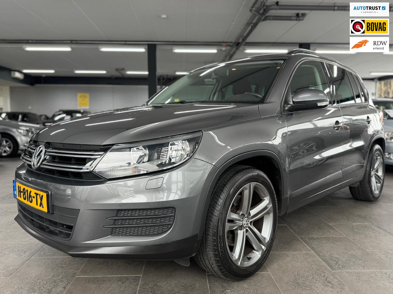 Volkswagen Tiguan - 1.4 TSI Sport&Style navi clima cruise controle lm-velgen parkeersensoren stoelverwarming t - AutoWereld.nl
