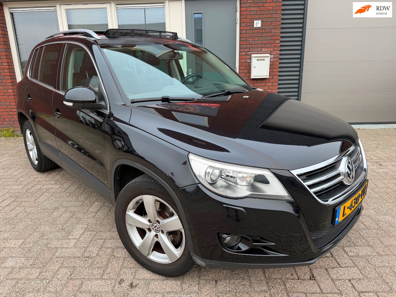 Volkswagen Tiguan - 2.0 TSI Comfort&Design 4Motion / Pano / PDC / Navi / DSG - AutoWereld.nl
