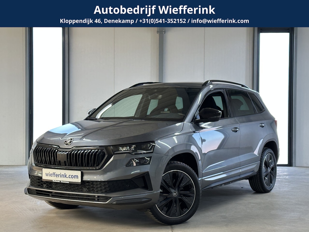 Skoda Karoq - 1.5 TSI ACT Sportline Business DSG | Navi | Camera | Trekhaak | - AutoWereld.nl