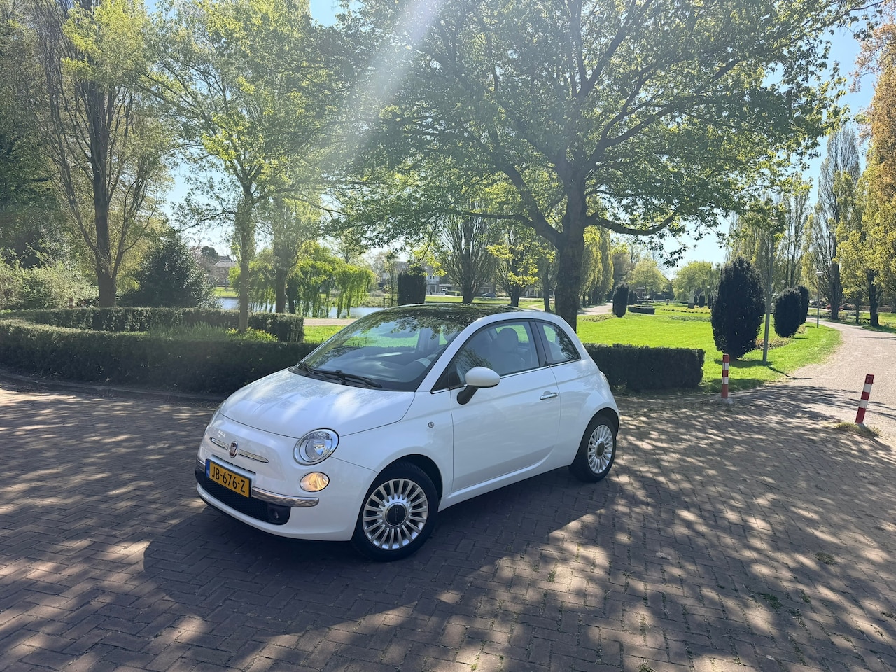 Fiat 500 - 1.2 Lounge | Panorama dak | Lage KM's | Airco | Elektrisch pakk. - AutoWereld.nl