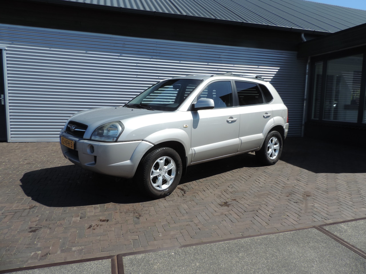 Hyundai Tucson - 2.7i V6 4WD Style 2.7i V6 4WD Style - AutoWereld.nl