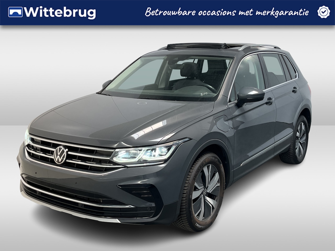 Volkswagen Tiguan - 1.4 TSI eHybrid Elegance / AUTOMAAT/ TREKHAAK/ PANO/ 245 PK/ CAMERA/ PARK. SENSOREN/ IQ. L - AutoWereld.nl