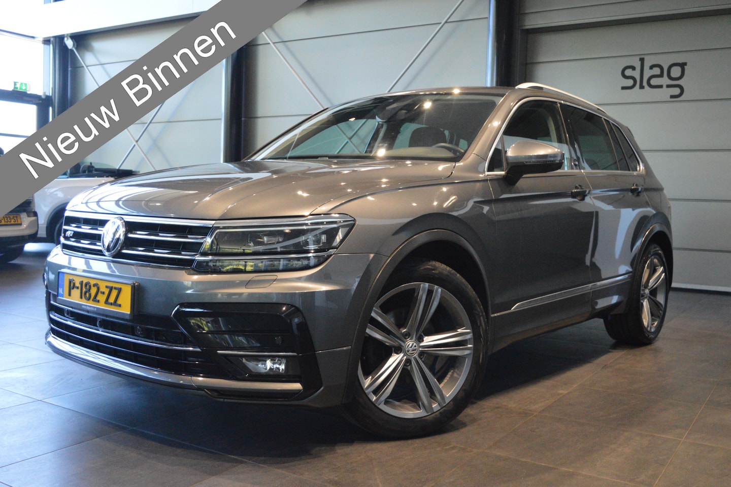 Volkswagen Tiguan - 1.4 TSI ACT R-LINE navi clima camera led trekhaak 150 pk !! - AutoWereld.nl