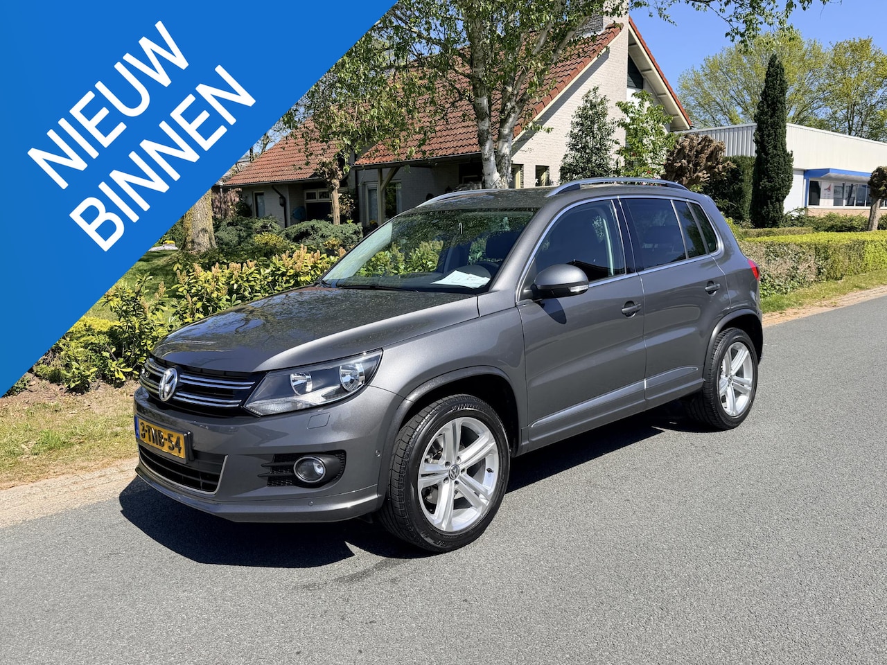 Volkswagen Tiguan - 1.4 TSI R-Line 122PK Navi•Trekhaak - AutoWereld.nl
