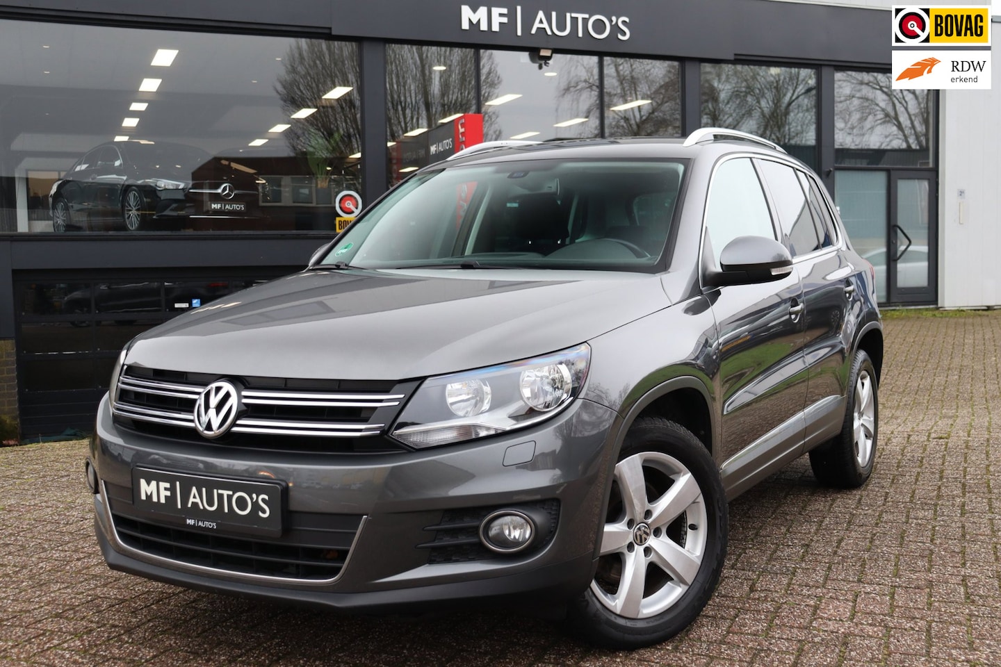Volkswagen Tiguan - 1.4 TSI Sport&Style|Navi|Stoelvw|Clima|PDC|Cruise - AutoWereld.nl