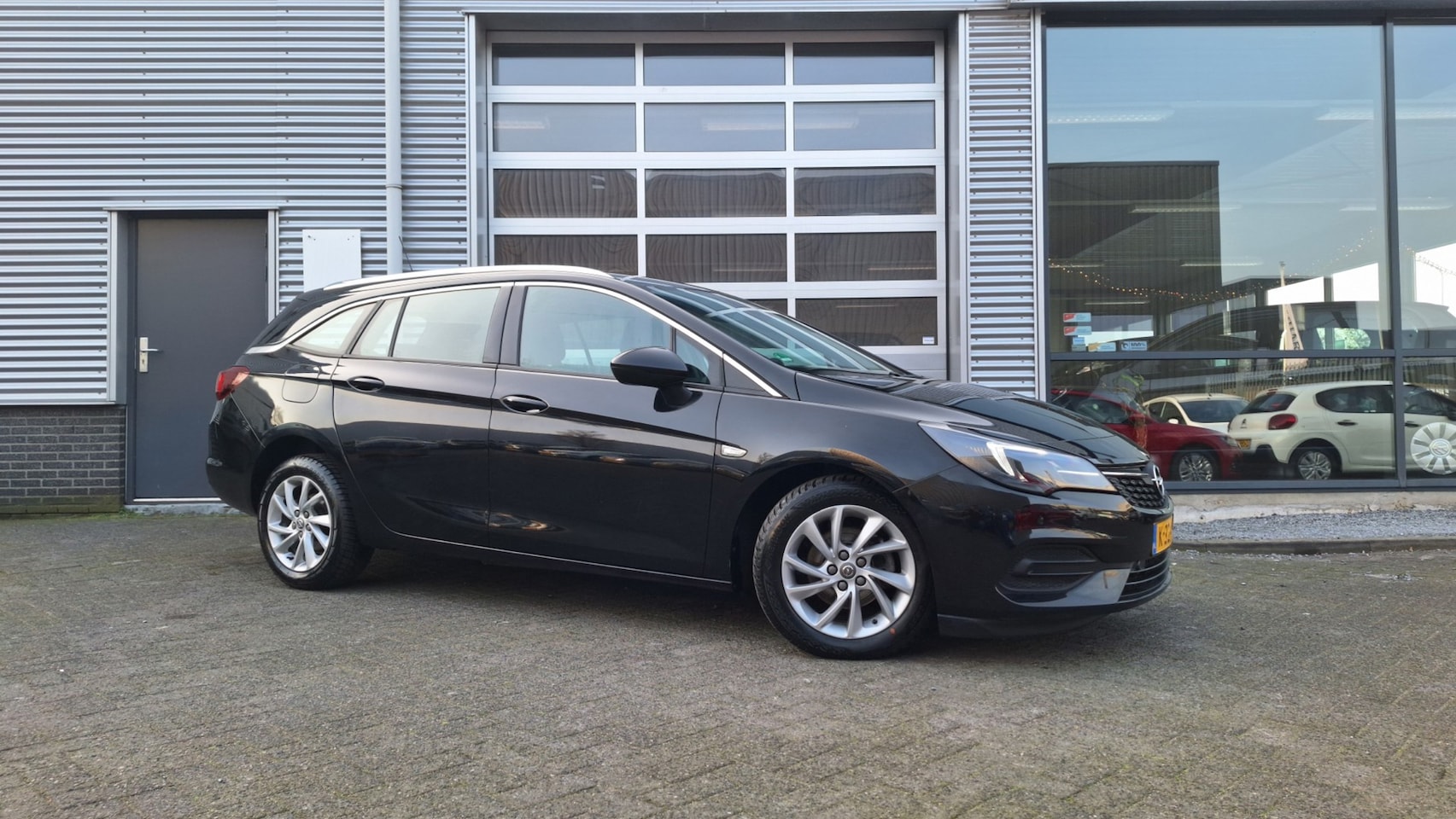 Opel Astra Sports Tourer - 1.4 Bus Eleg/Automaat/Camera/Cruise/Trekhaak/Pdc/Enz - AutoWereld.nl