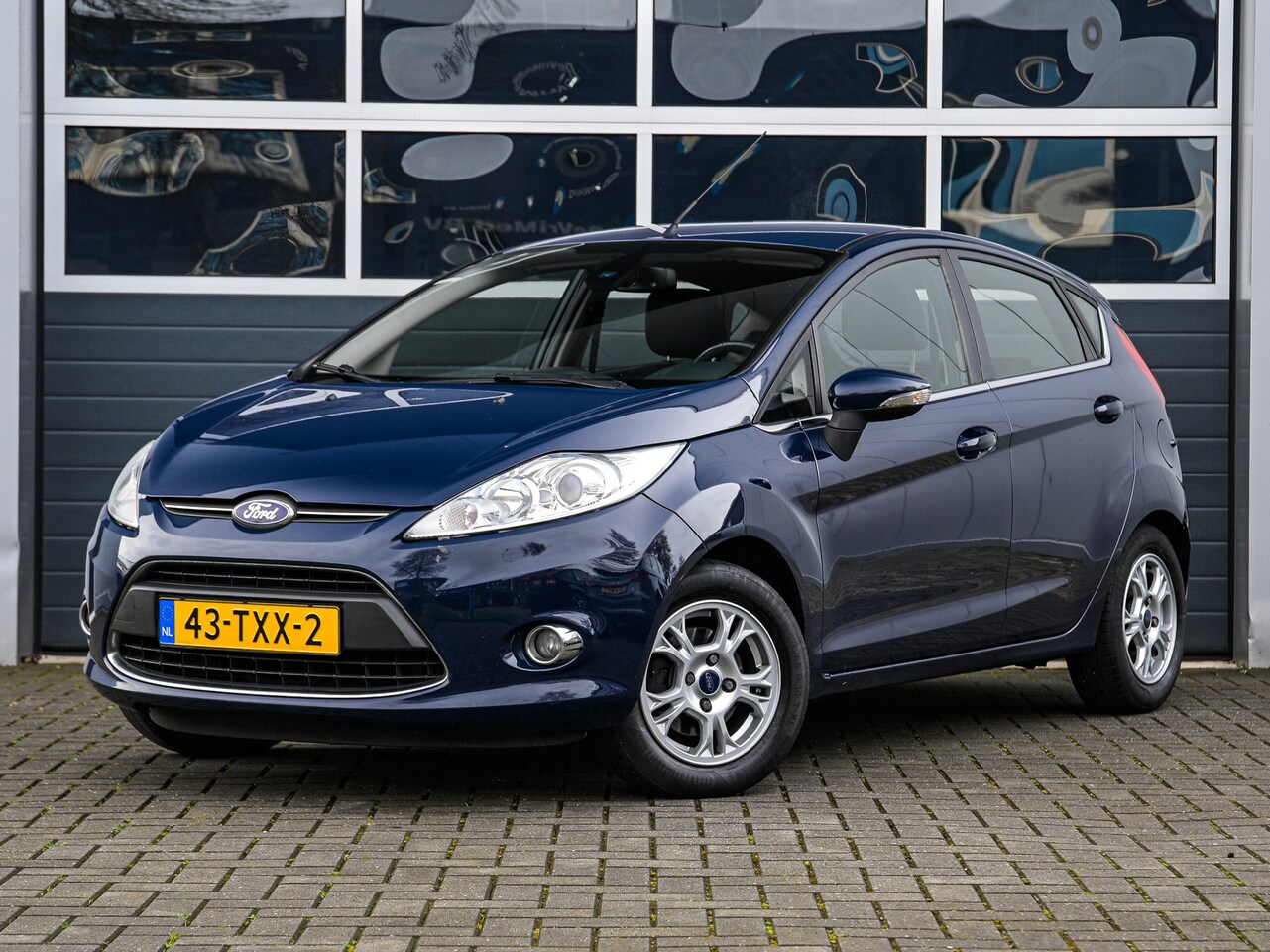 Ford Fiesta - 1.6 TDCi Lease Titanium | Climate control | Cruise control | PDC | Trekhaak - AutoWereld.nl